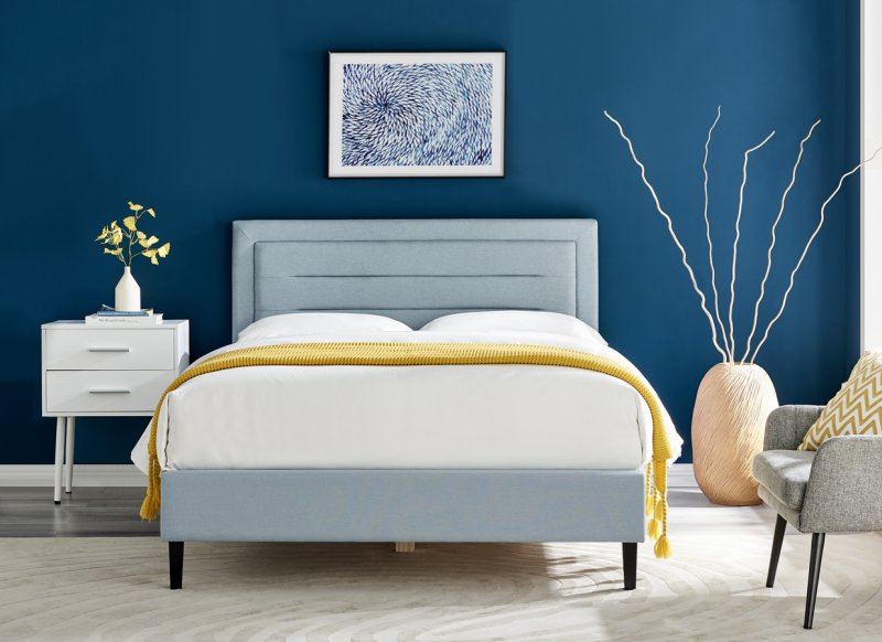 Ortase bedstead in pale blue fabric