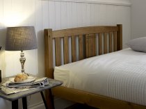 Pinner Wooden bed frame in honey finish